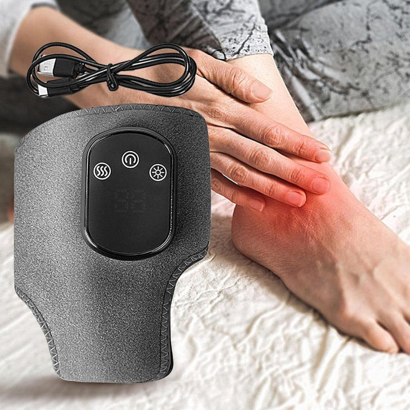 Person using a handheld electronic device on their leg with visible heating effect