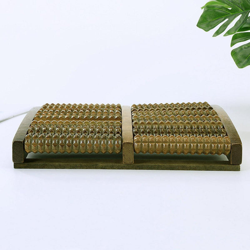 Wooden roller with textured surface on a white background